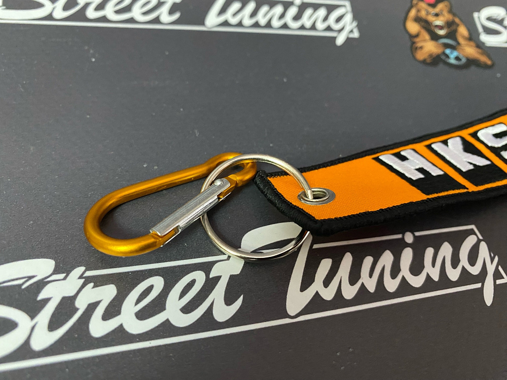 картинка Брелок для ключей HKS "тканевый", оранжевый от магазина  StreetTuning