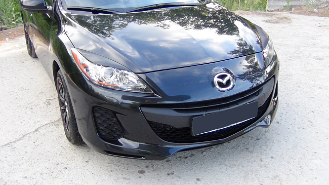 картинка Mazda 3 (седан, хэтчбэк) 2010—2013 Накладки на передние фары (реснички) компл.-2 шт. магазин  StreetTuning 