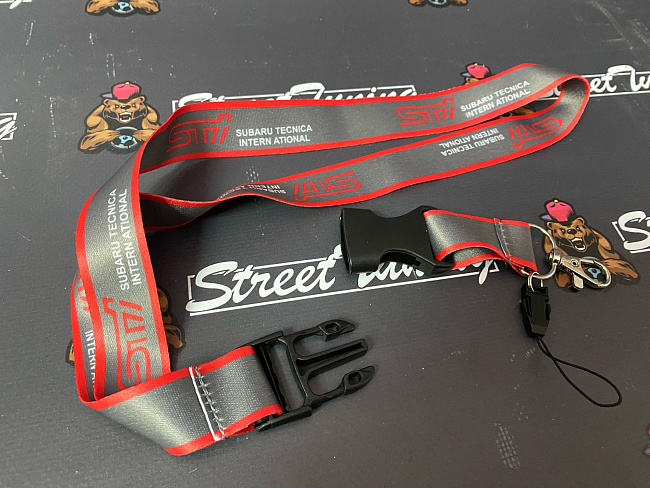 картинка Шнурок для ключей STI "тканевый", серый магазин  StreetTuning 