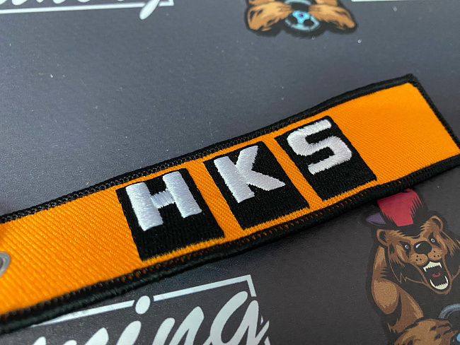 картинка Брелок для ключей HKS "тканевый", оранжевый магазин  StreetTuning 